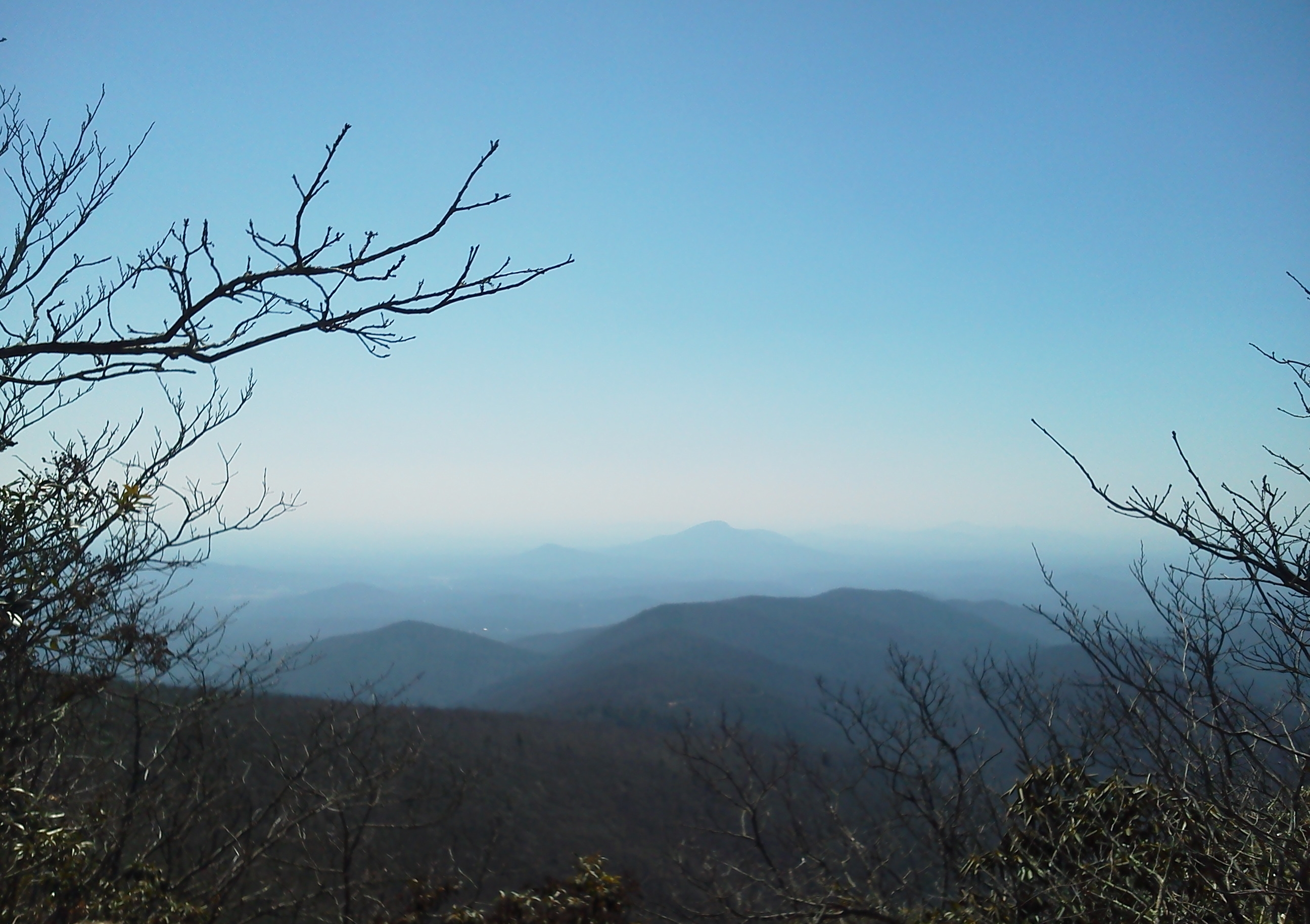 Layered mountain views from Tray Mountain, Georgia; illustrative Appalachian scenery, not a photograph of the sanctuary property.