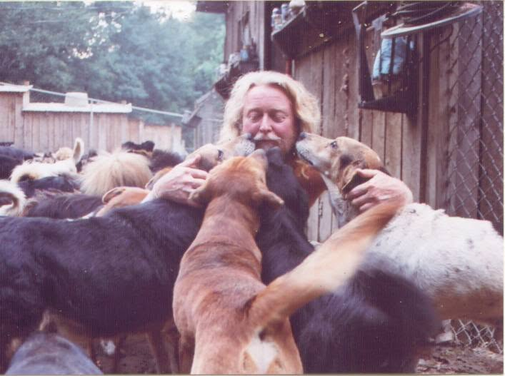 Randy Skaggs surrounded by rescued dogs
